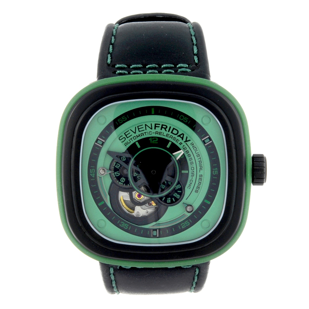 SEVENFRIDAY - a gentleman's wrist watch. PVD coated Stainless steel and green rubber case.