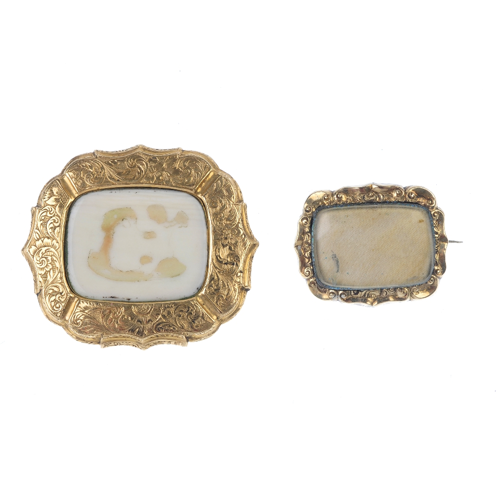 Two late Victorian gold memorial brooches. To include an ivory scrolling brooch, together with a