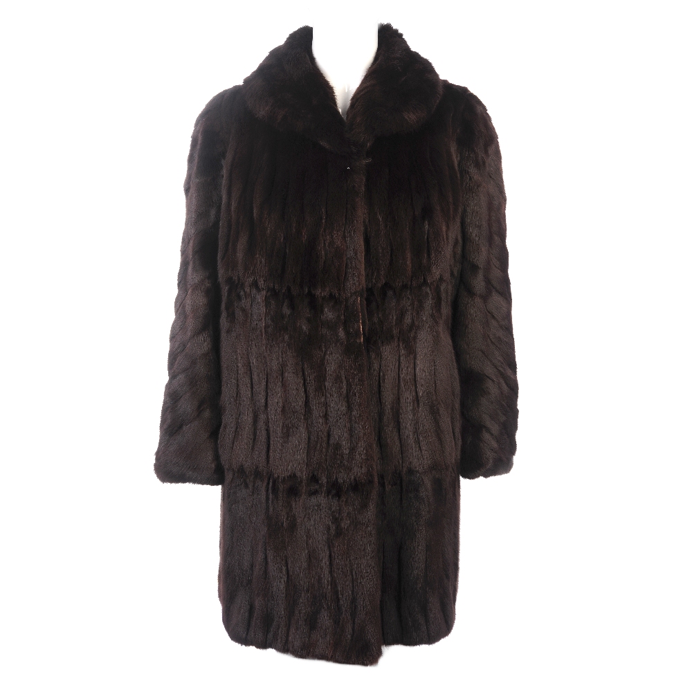 Two knee-length fur coats. To include a dyed ermine coat, designed with a lapel collar and hook