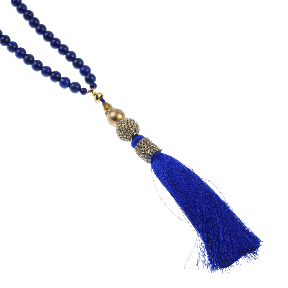 A treated lapis lazuli necklace and ear pendants. The necklace designed as a series of spherical