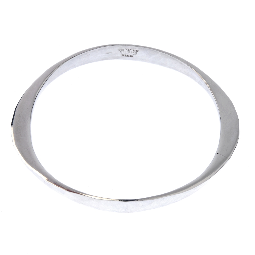 TONE VIGELUND - a bangle. The bangle with hammered finish, the profile tapering to the sides.