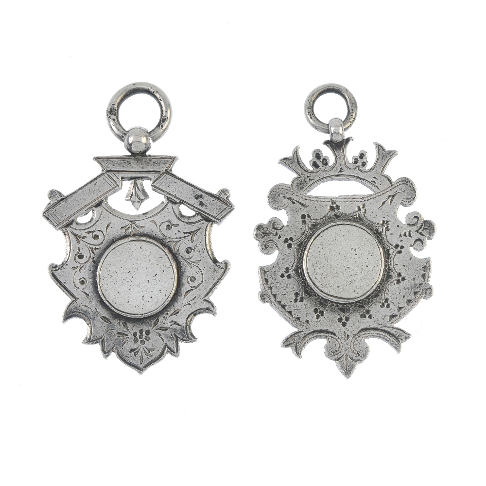 A selection of silver and white metal jewellery. To include six shield-shape medallions, two with