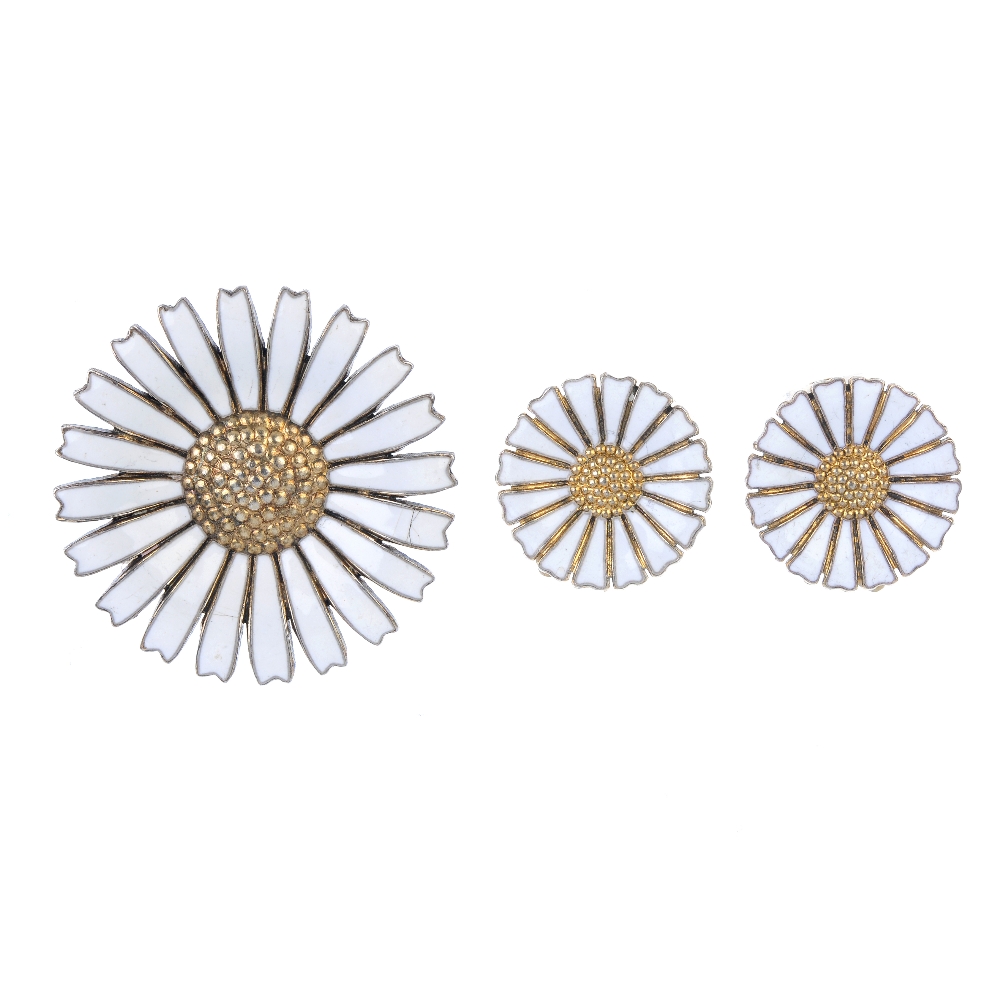 ANTON MICHELSEN - an enamel brooch and ear clip set. To include a white enamel daisy brooch,