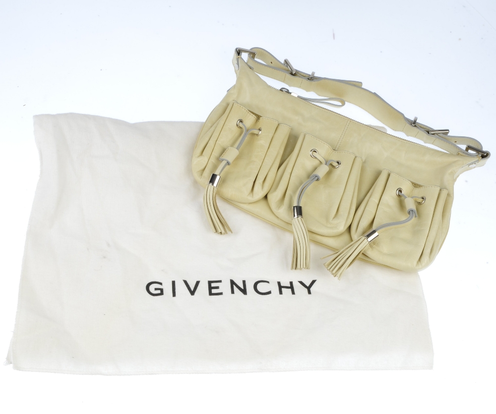 Two designer bags. To include a small cream leather shoulder bag by Givenchy, featuring three - Image 4 of 5