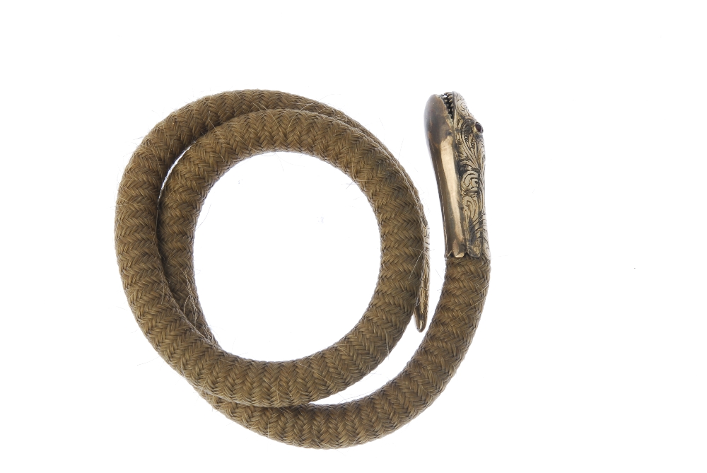 A mid Victorian hair and gold snake bracelet. Designed as a spiral band of woven hair, with - Image 2 of 2
