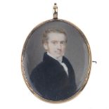 A mid Victorian hand painted portrait miniature mourning brooch. Of oval outline, the portrait of