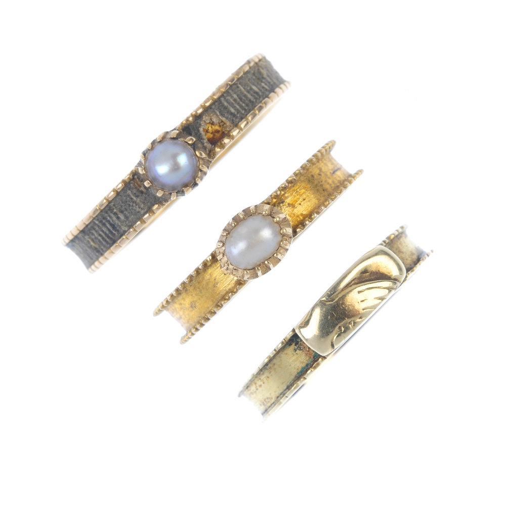 A selection of three mid Victorian gold memorial rings. To include two split pearl and woven hair