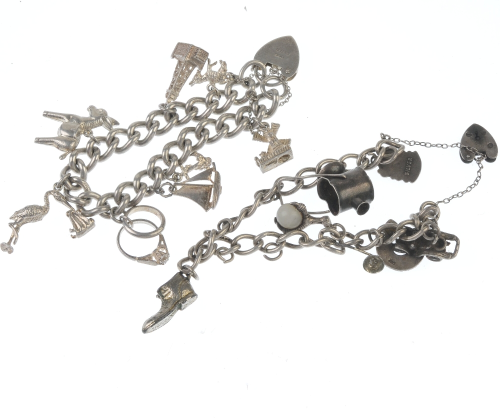 Two charm bracelets. The two curb-link chains suspending a total of fifteen charms including a - Image 2 of 2