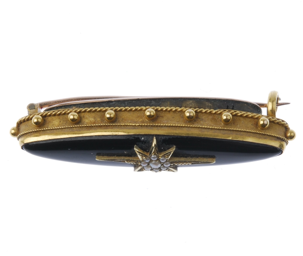 A late 19th century gold memorial brooch. Designed as a marquise-shape onyx set to the central - Image 2 of 3