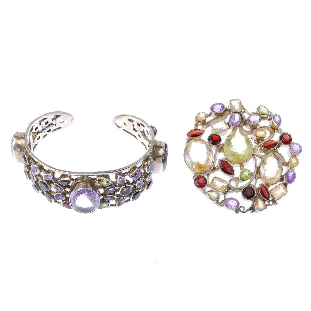 A gem-set bangle and pendant. The bangle with collet-set amethyst, peridot, smoky quartz and