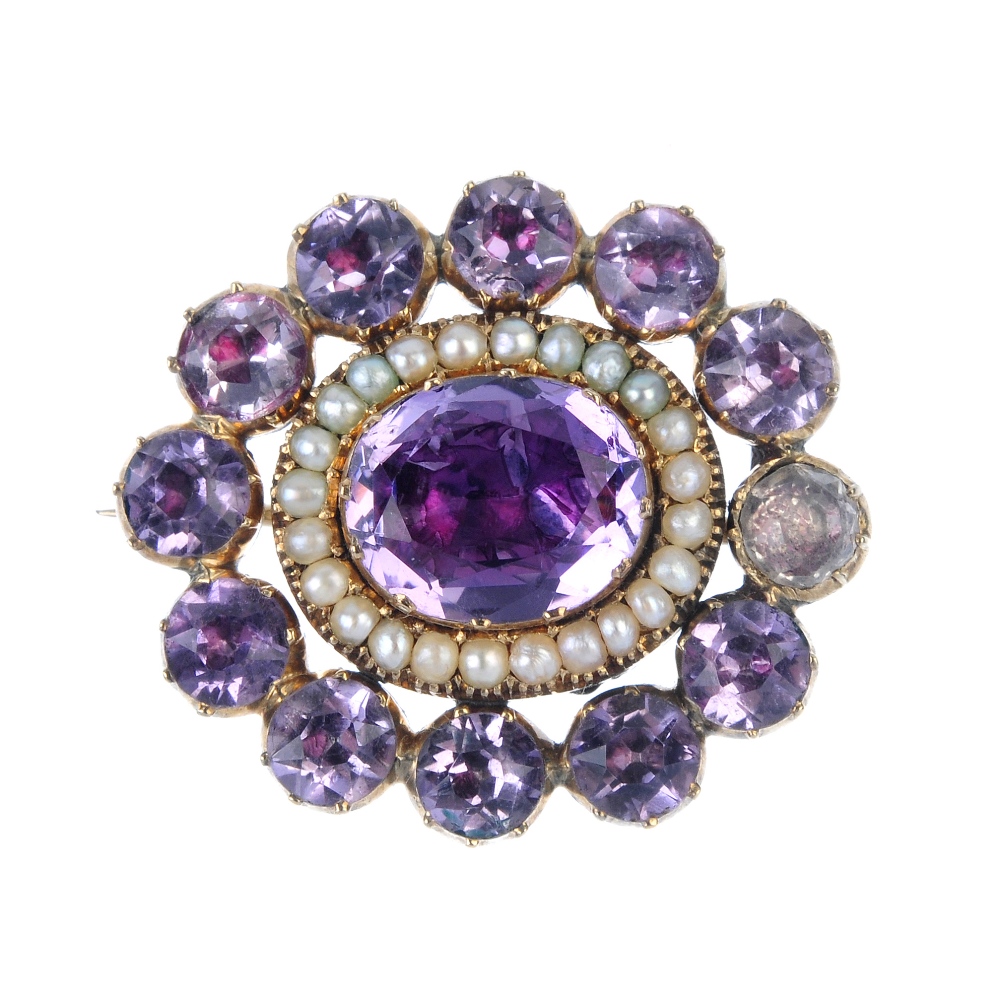 A late 19th century amethyst and split pearl mourning brooch. The central oval-shape foil-backed