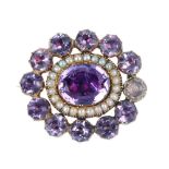 A late 19th century amethyst and split pearl mourning brooch. The central oval-shape foil-backed