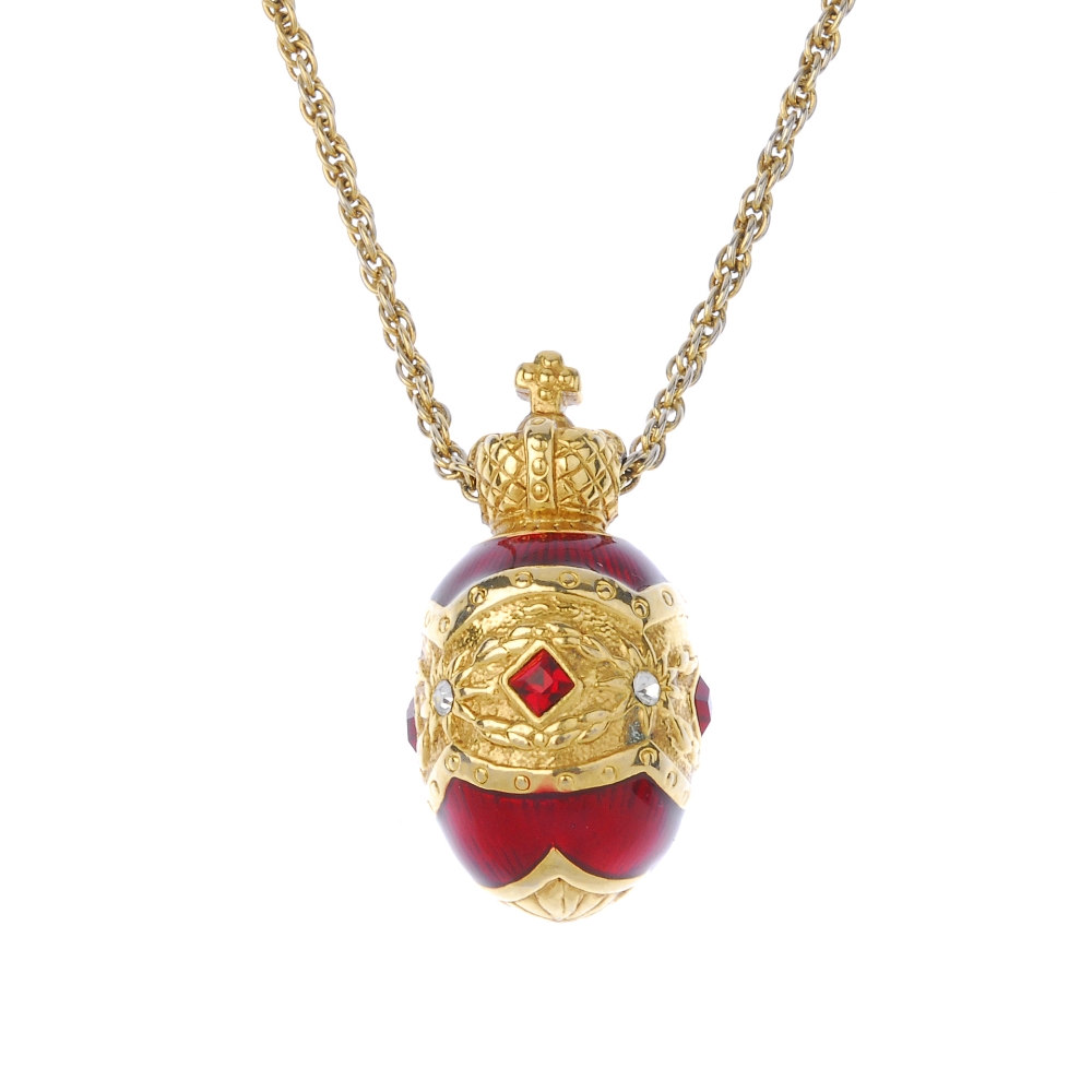 JOAN RIVERS - a pendant and chain. Designed as a red enamel egg with central red and colourless