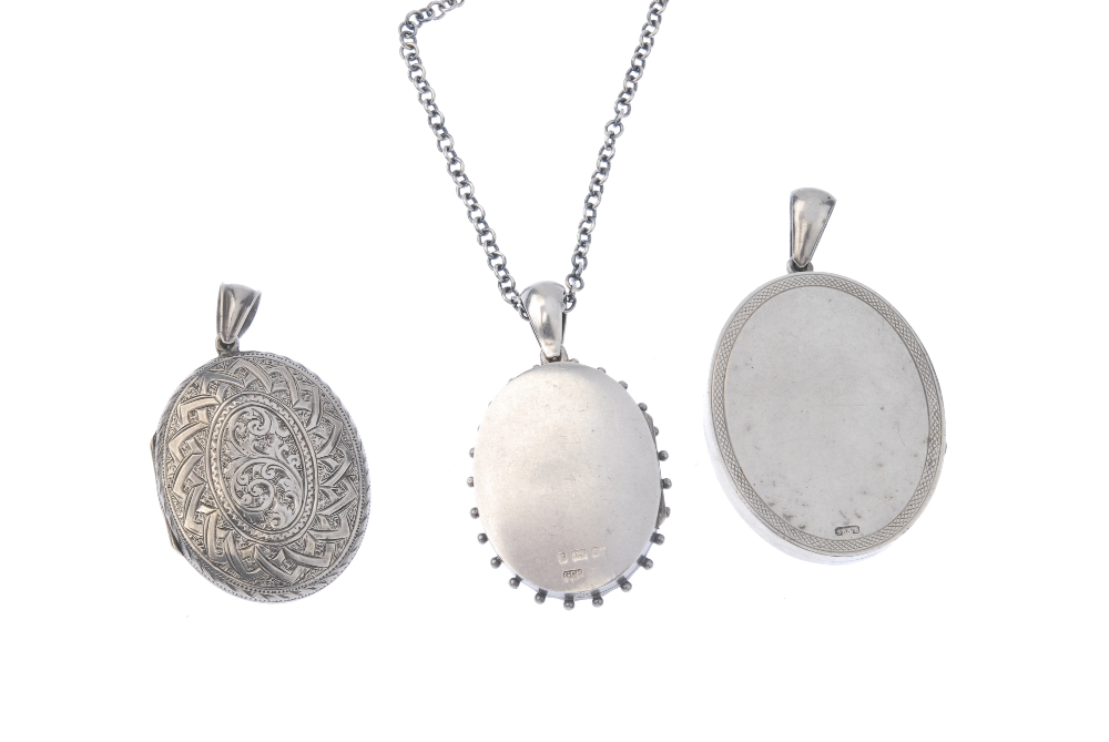Three late Victorian oval silver lockets and a later chain. To include one engraved to depict a bird - Image 2 of 3