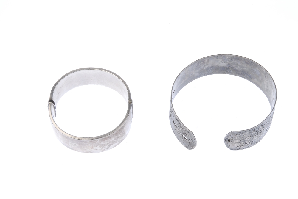 Two silver bangles. To include a 1940s silver floral embossed bangle and a 1960s silver foliate - Image 2 of 2