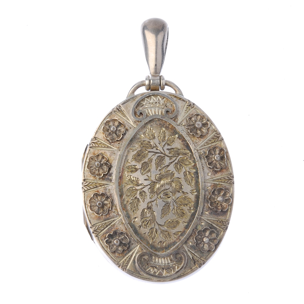 A late Victorian silver locket and collar. The oval-shape locket, with engraved and applied floral
