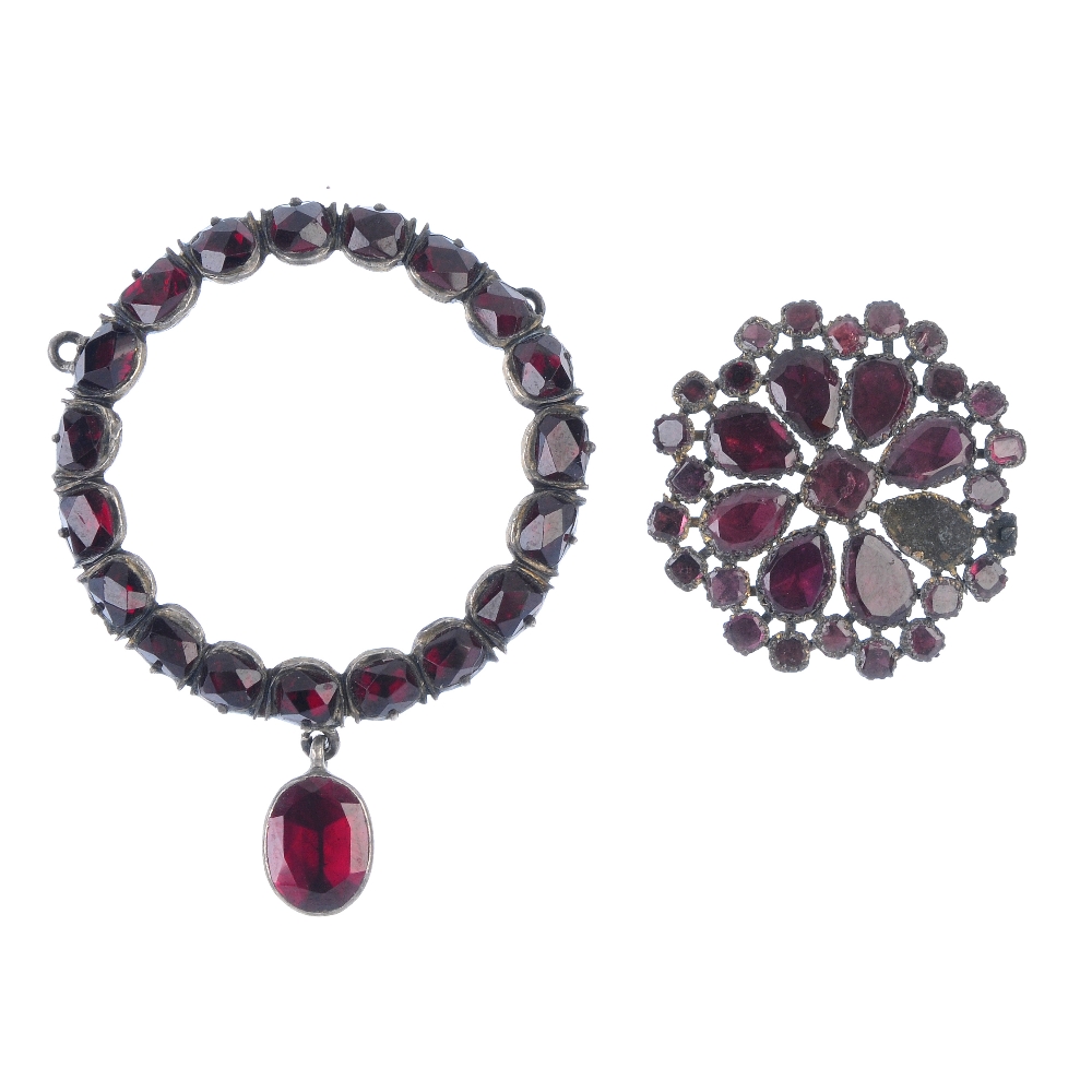 A selection of three foil-back garnet items. To include a circular-shape garnet cluster ring, a