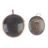 Two mid Victorian memorial pendants. The first of oval outline with monogram and seed pearl crown
