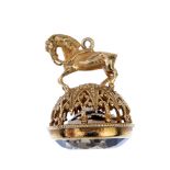 A 9ct gold smoky quartz fob. The circular smoky quartz, to the pedestal designed as a horse with