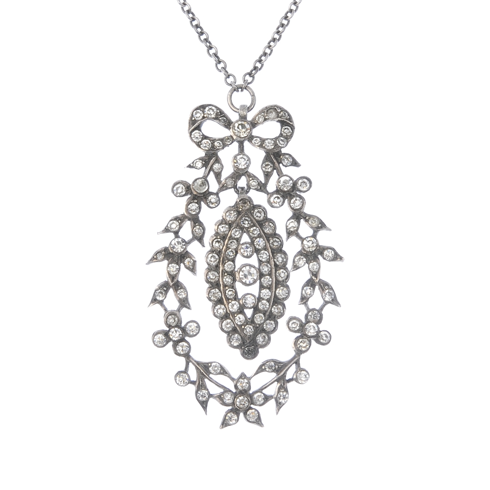 A mid 20th century continental silver paste pendant. The circular-shape colourless paste marquise-