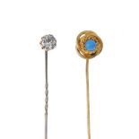 Two stickpins. The first a turquoise cabochon to the rope-twist surround and a colourless paste