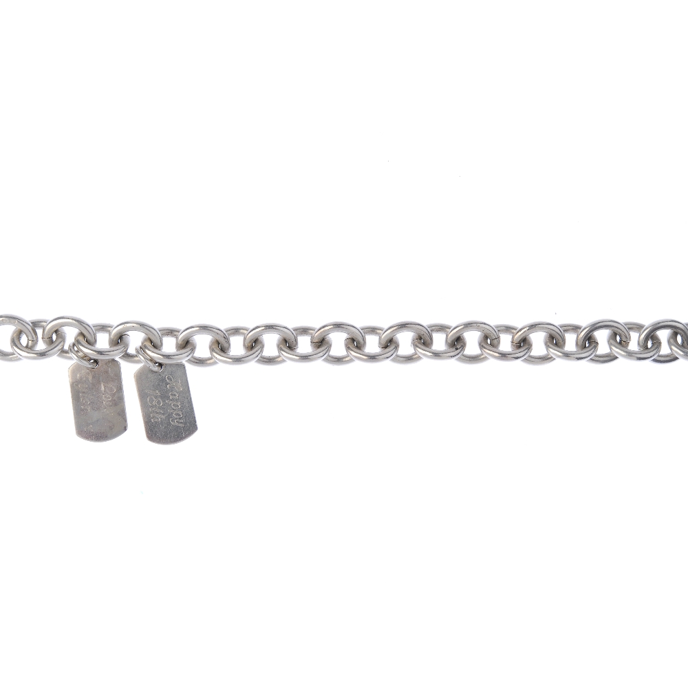GUCCI - a silver bracelet. The belcher-link bracelet suspending two 'Gucci' engraved dog tags,