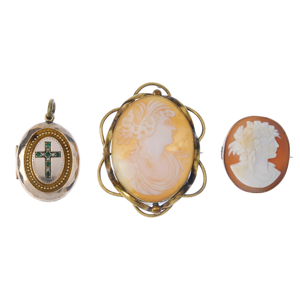 Two cameo brooches and a locket. The locket of oval outline, with a seed pearl and green gem-set