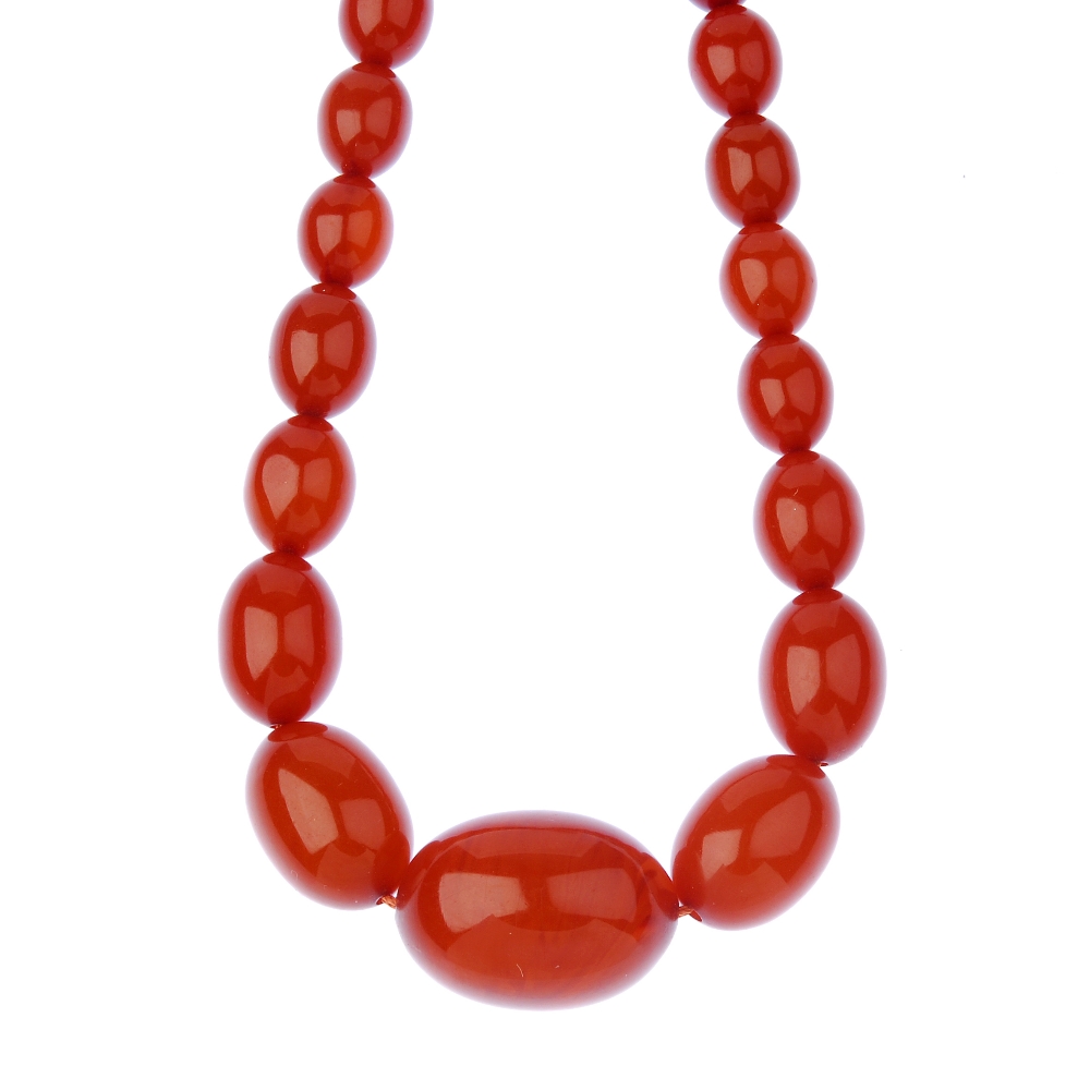 Three plastic bead necklaces. The first designed as a red plastic bead necklace, the flattened