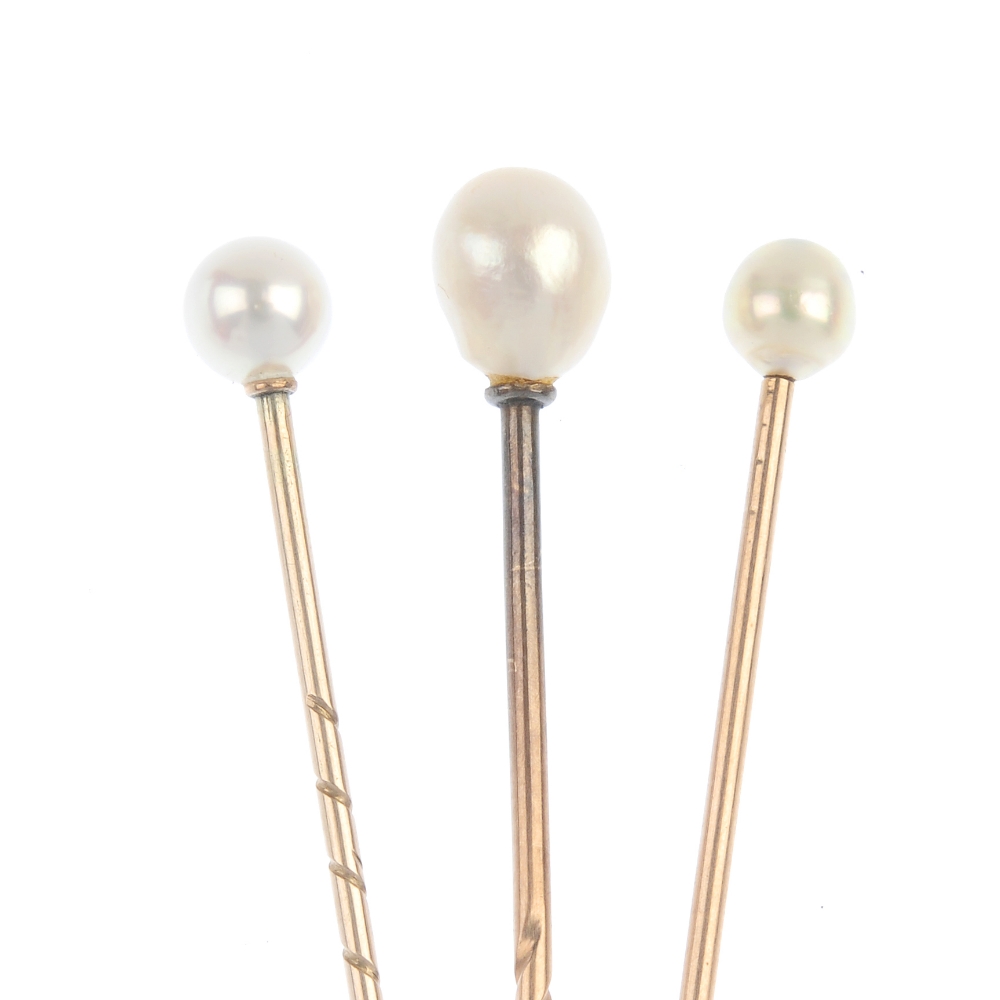 A selection of three cultured pearl stickpins. Each set with a single spherical or semi-baroque