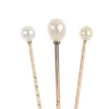 A selection of three cultured pearl stickpins. Each set with a single spherical or semi-baroque