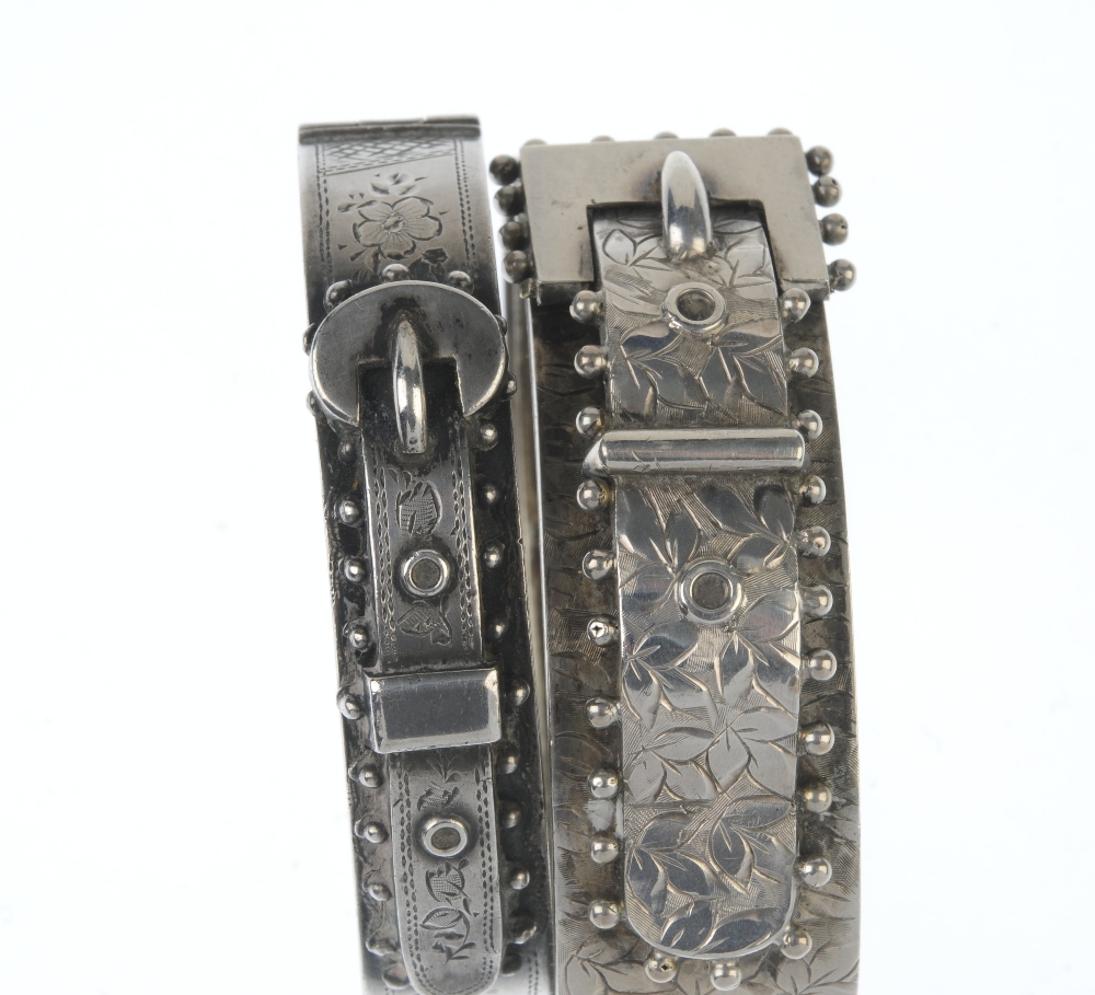 Two late Victorian silver hinged bangles. Both designed as buckles, the first with engraved ivy - Image 2 of 3
