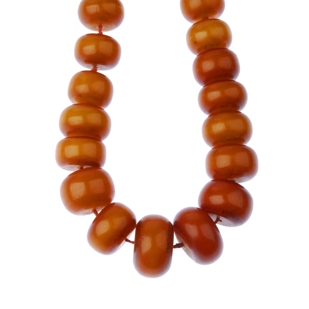 Two large plastic bead necklaces. The first designed as thirty-five graduated bouton-shape beads,