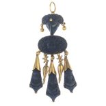 A late 19th century archaeological revival lava ram and cameo pendant. Comprising three black lava