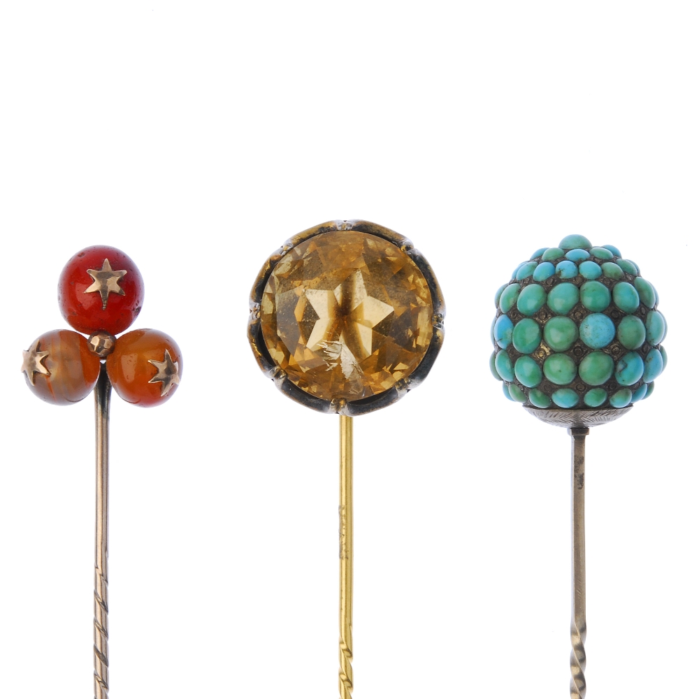 A selection of gem-set stickpins. To include a late 19th century carnelian sphere trefoil