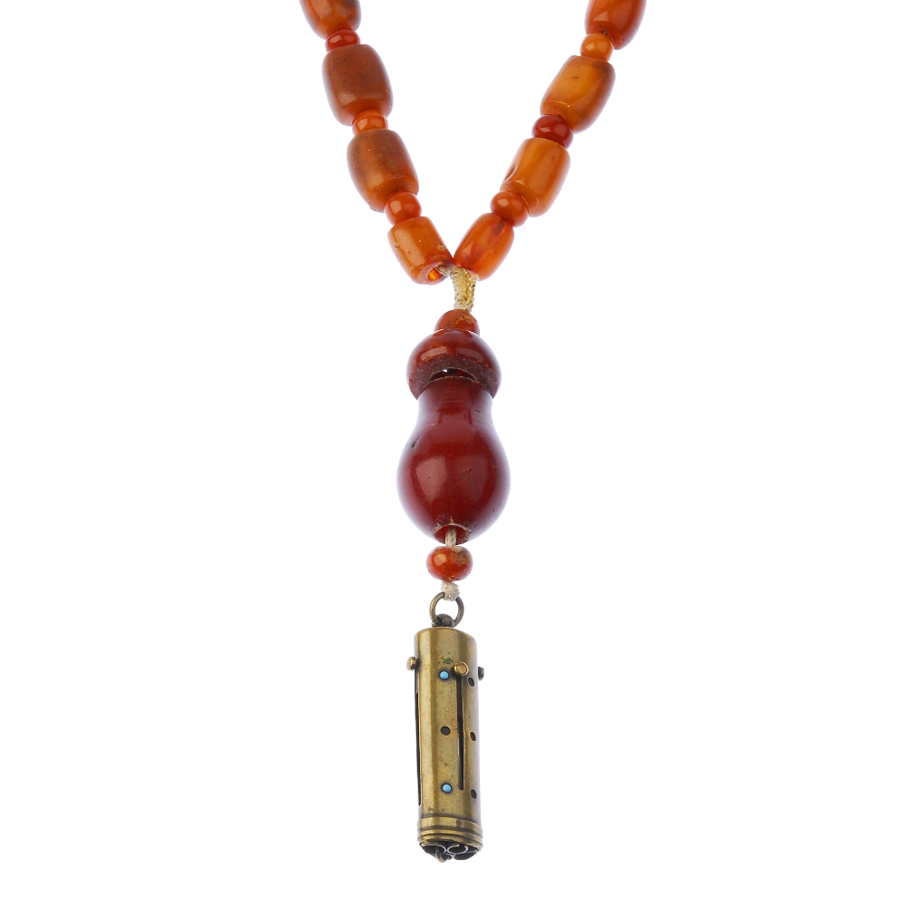 A natural amber necklace. Designed as thirty-eight natural amber beads or barrel and bouton shapes