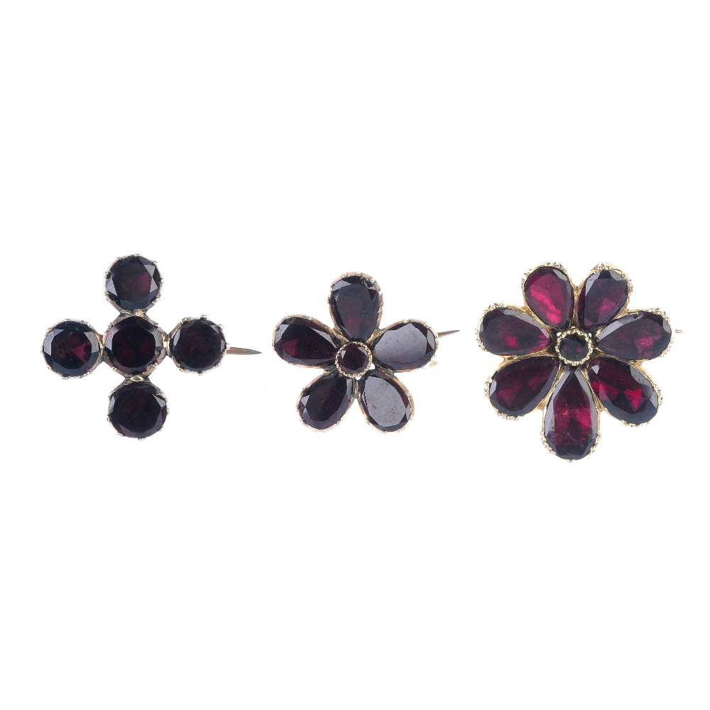 A selection of three 19th century gold foil back garnet brooches. To include a floral cluster