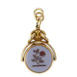 A late Victorian 18ct gold carnelian locket fob. The circular fob with a monogrammed bloodstone to