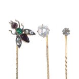 A selection of three early 20th century paste stickpins. To include a green, red and colourless