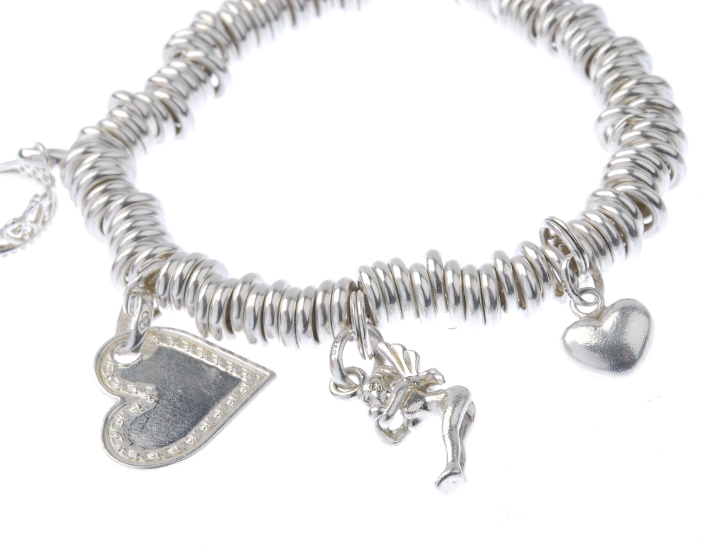 Five items of silver designer jewellery. To include two 'Sweetie' charm bracelets and a plain band - Image 6 of 9