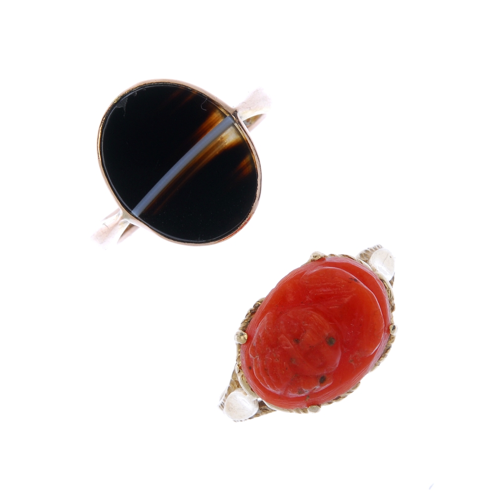 Two gem-set rings. The first a dyed coral cameo, carved to depict the portrait of a man, the