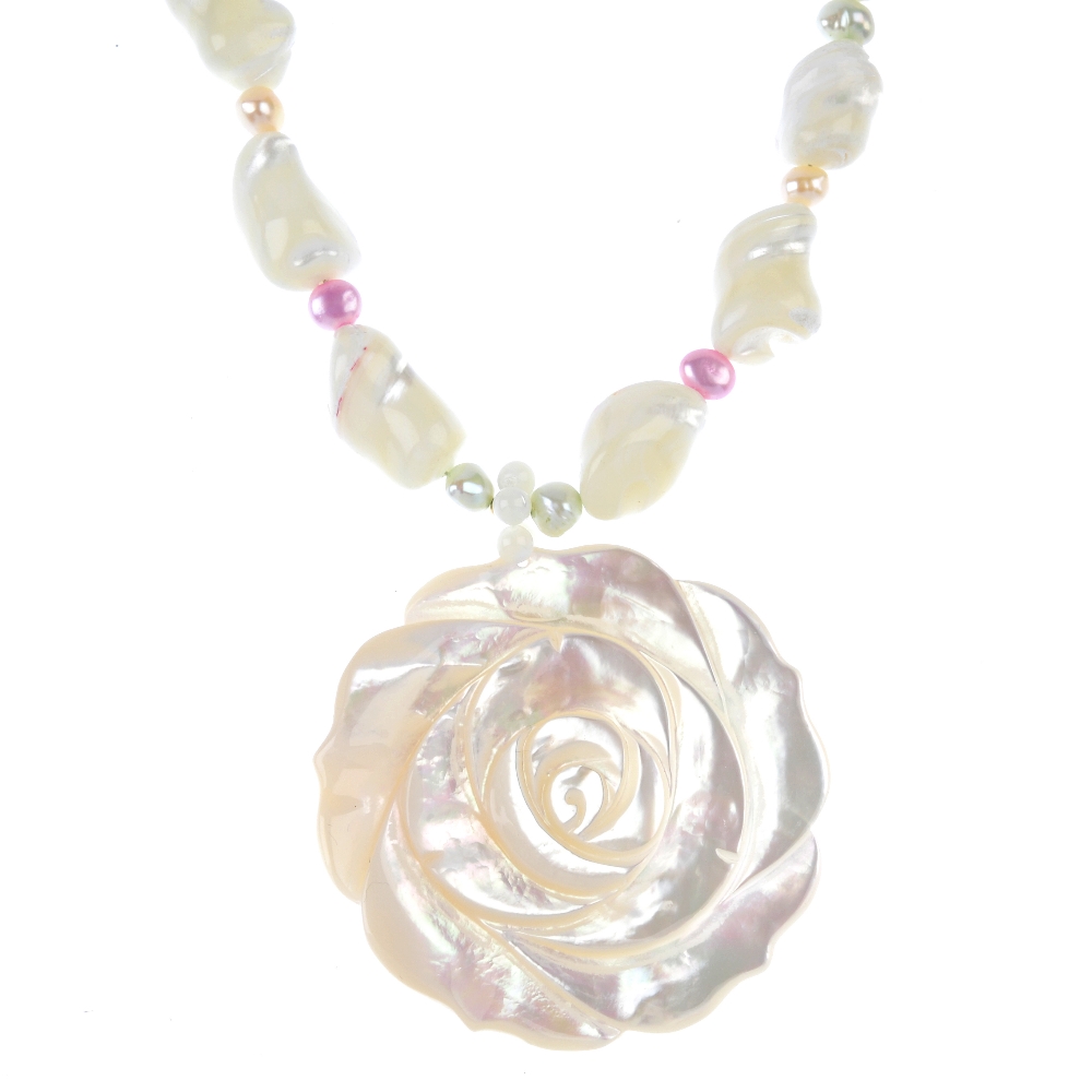A selection of mother-of-pearl, cultured pearl, shell and paste jewellery. To include an abalone