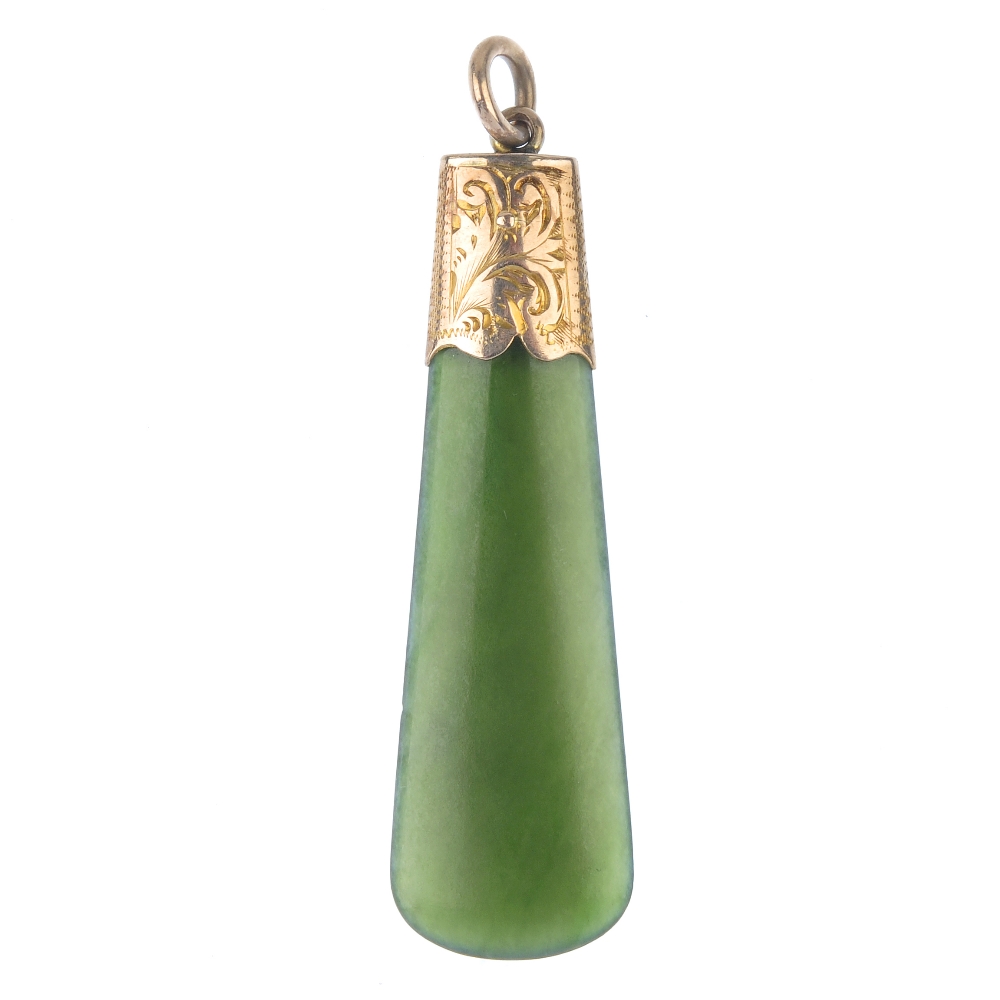A nephrite pendant and French jet earrings. The pear-shape pendant with engraved cap, together