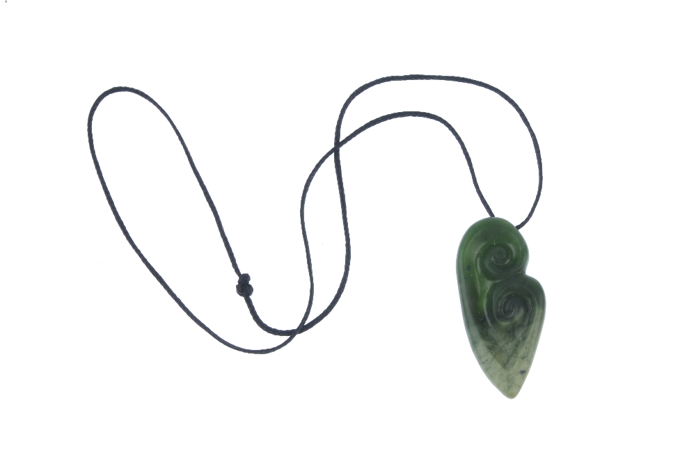 A carved New Zealand jade double Koru pendant by Paddy Cooper. The Koru representing an unfurling - Image 3 of 3