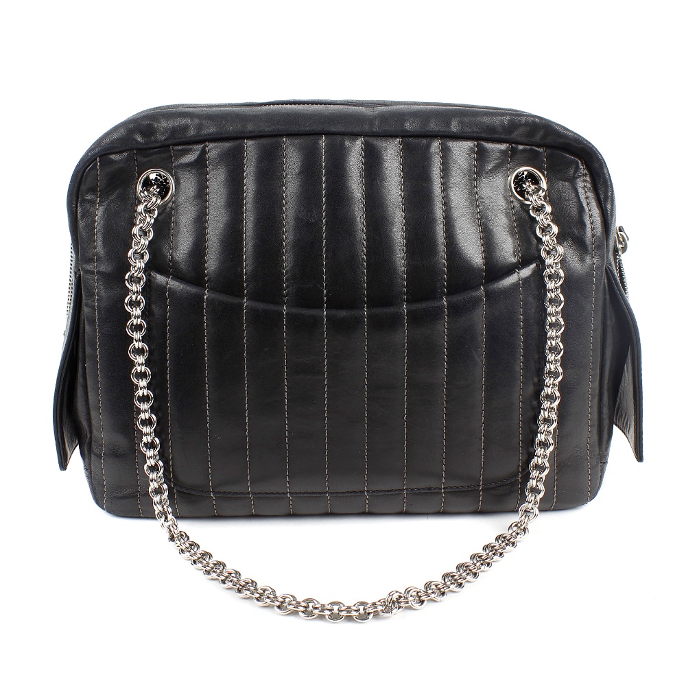CHANEL - a pinstripe leather bag. In black leather, with grey stitched parallel lines, two outer