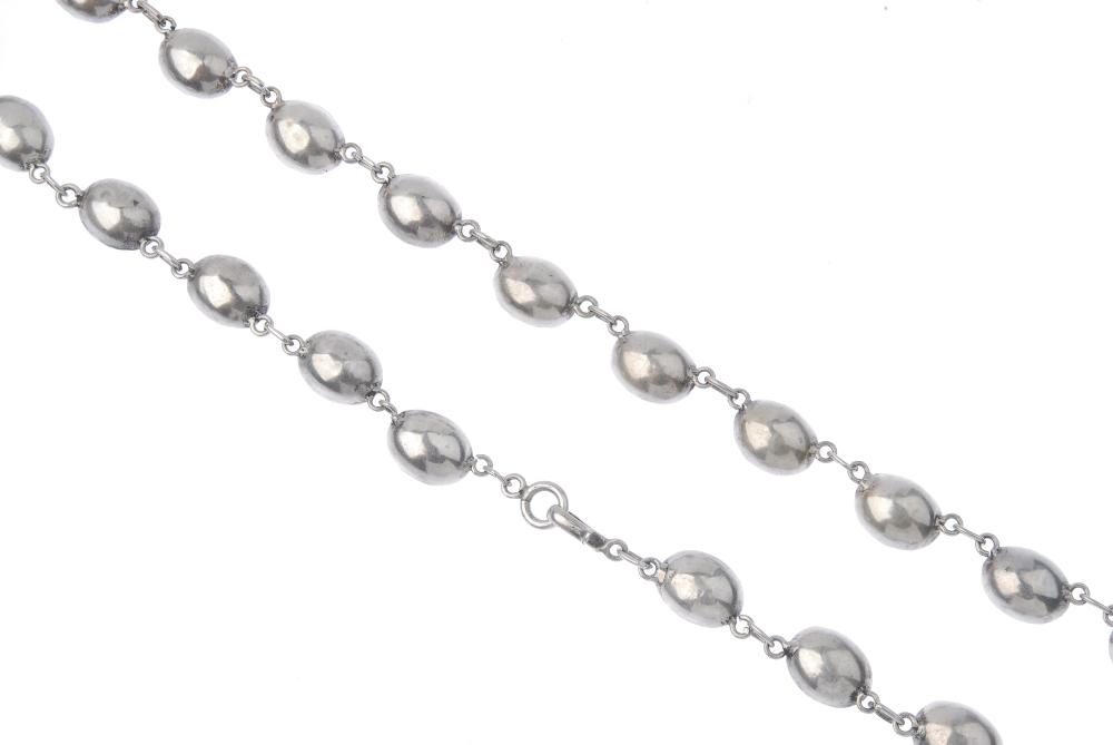 A mid 19th century silver paste necklace. The replacement graduated oval-shape foil-back purple - Image 2 of 3