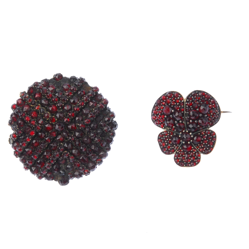 Two late 19th century garnet and paste brooches. To include a circular-shape red paste and garnet