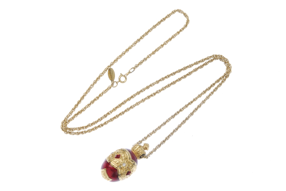 JOAN RIVERS - a pendant and chain. Designed as a red enamel egg with central red and colourless - Image 2 of 2