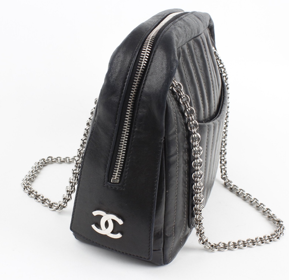 CHANEL - a pinstripe leather bag. In black leather, with grey stitched parallel lines, two outer - Image 2 of 7
