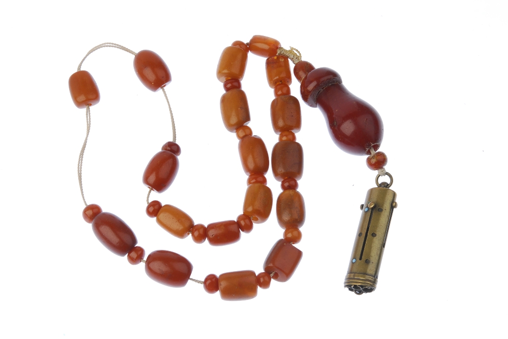 A natural amber necklace. Designed as thirty-eight natural amber beads or barrel and bouton shapes - Image 2 of 2