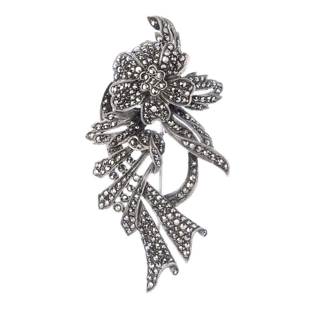 Twenty-three items of marcasite jewellery. To include a brooch designed as a floral spray set with